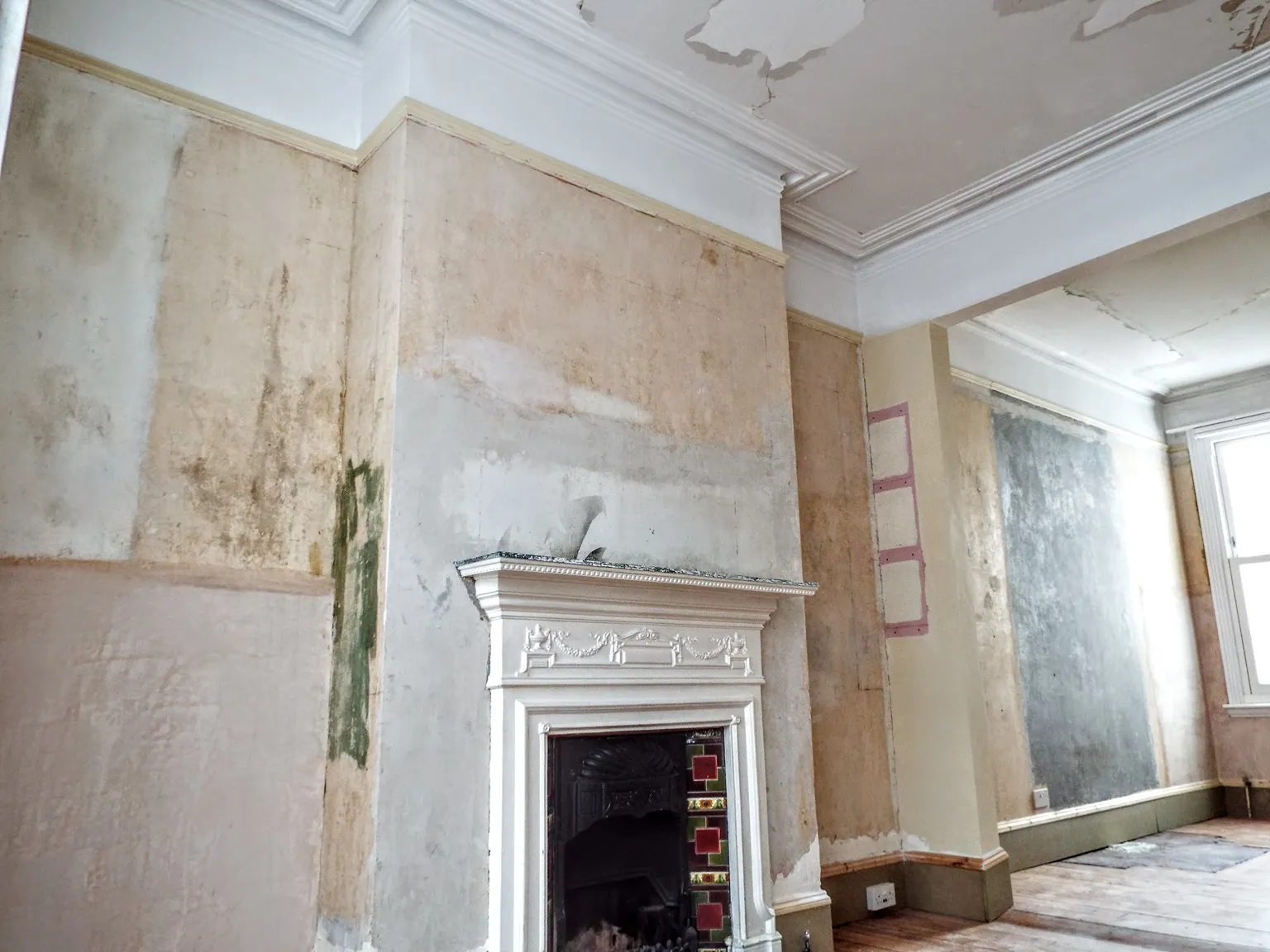 Room with old lining paper removed before redecoration