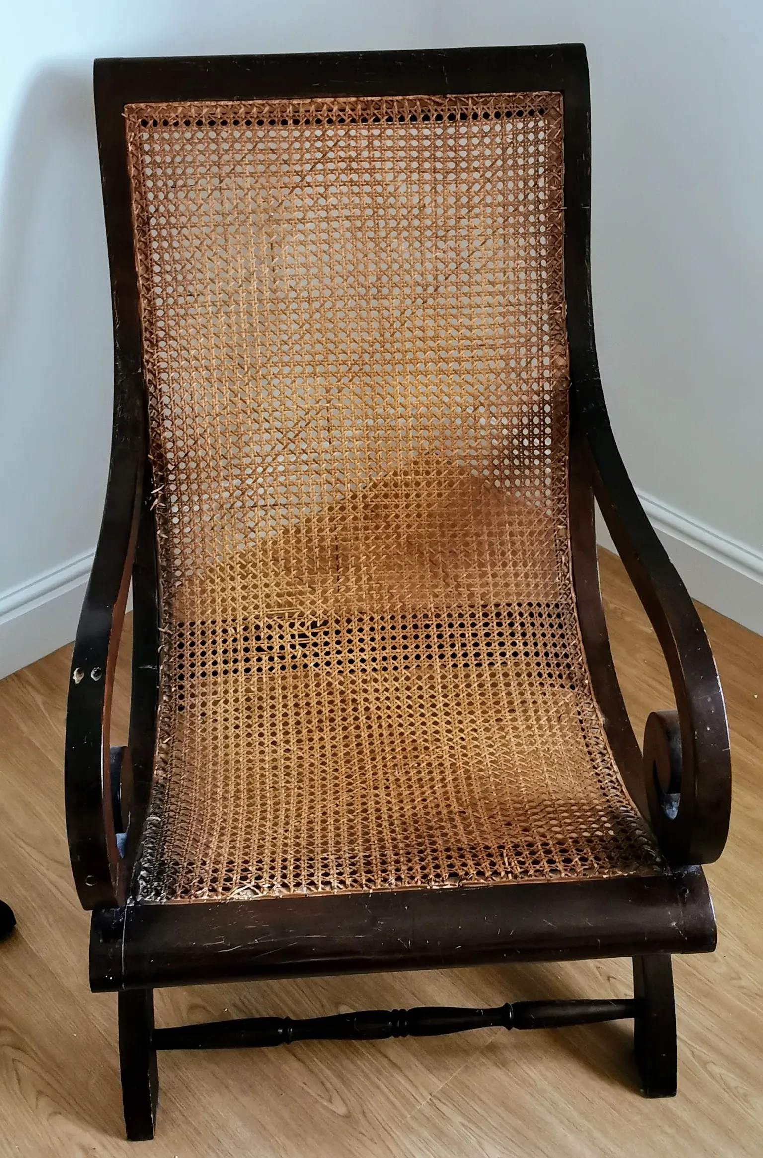 A rustic wood and wicker chair